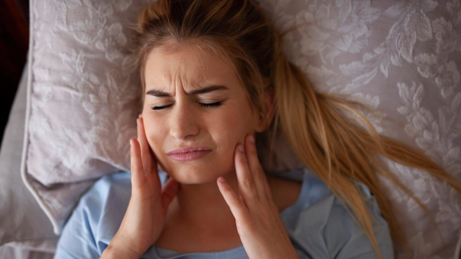 Woman suffering from bruxism